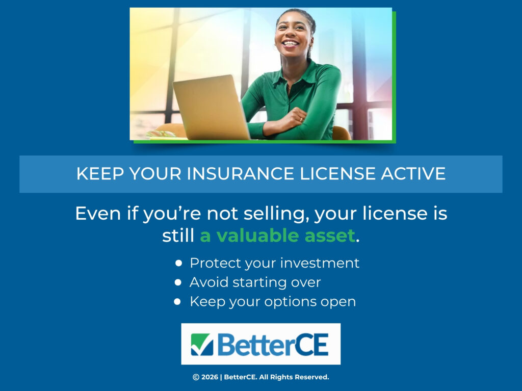 Smiling woman sitting at a desk using a laptop. Three reasons to keep your insurance license active if not selling.